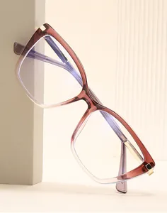Detail of cat eye glasses frame with gradient brown finish and blue light coating