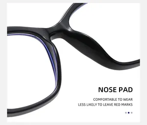 Detail of ergonomic integrated nose pads on black cat-eye glasses for comfortable wear