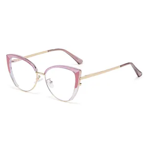 Monture de lunettes œil de chat moderne en métal doré avec détails roses pour femmes