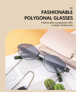 Close-up of polygon sunglasses with metal chain and beige leather pouch on stylish desk