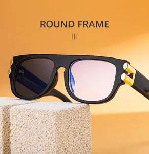 Detail of square black frame sunglasses with gold hexagonal metal accents on temples