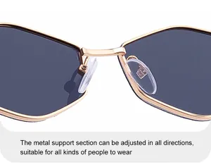 Macro view of adjustable silicone nose pads and golden metal bridge for stylish sunglasses