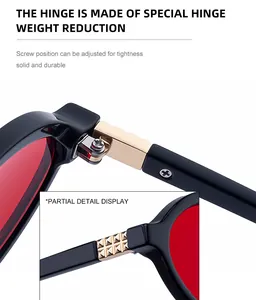 Detailed macro view of the gold metal hinge on fashion oval sunglasses with red lenses
