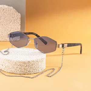 Polygonal sunglasses with silver metal frame, gradient lenses, and stylish eyewear chain