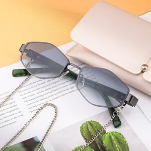 Chic hexagonal gunmetal sunglasses with gradient lenses and decorative metal chain