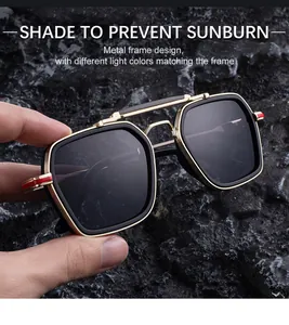 Detail of square frame sunglasses with golden metal temples and dark gray sun lenses