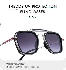 Close-up of square metal frame sunglasses with UV protection and gradient lenses