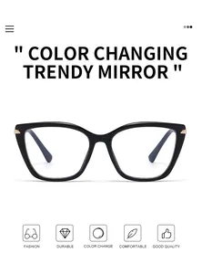 Close-up of black cat-eye sunglasses with color-changing lenses and gold hinges
