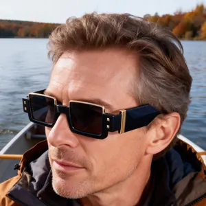 Close-up of men's square sunglasses with gold metal accents and dark UV lenses