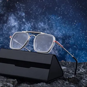 Retro square sunglasses with silver metal frames and striped detail on starry background