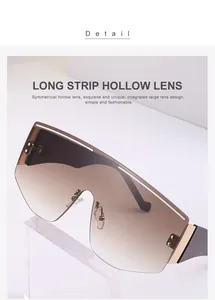 Detail view of large frameless sunglasses featuring long strip hollow lens and metal bridge