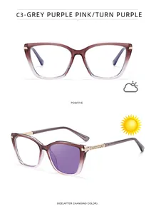 Detailed view of cat-eye frames showing photochromic transition from clear to purple tint