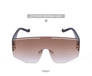 Front view of leopard print oversized shield sunglasses with brown gradient lenses