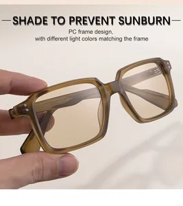 Close-up of translucent amber square frame sunglasses with metallic rivet details