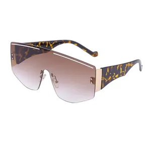 Oversized shield cycling sunglasses with brown gradient lenses and tortoise shell frames
