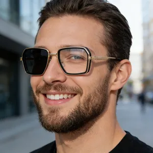 Detail of square photochromic sunglasses with black-gold metal frames and spring hinges