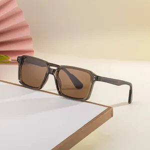 Modern square frame sunglasses with tea gray frame and brown lenses at a 45-degree angle
