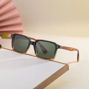 Square fashion sunglasses with black and tortoiseshell frames and dark green lenses