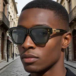 Close-up of stylish men's sunglasses with thick olive frames and gold metal temple details