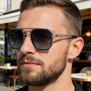 Detail of silver double-bridge frame and blue gradient lenses on aviator sunglasses