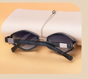 Detailed shot of polygon sunglasses with blue marble frame and white leather pouch