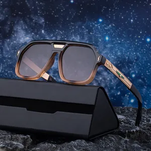 Men's square polarized sunglasses with gradient frames and gold metal temples on rocks