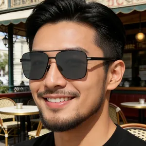 Close-up of polarized square sunglasses with stainless steel temples on model outdoors