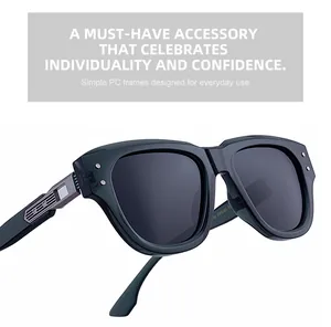 Detailed close-up of dark grey cat-eye sunglasses featuring silver metal temple accents