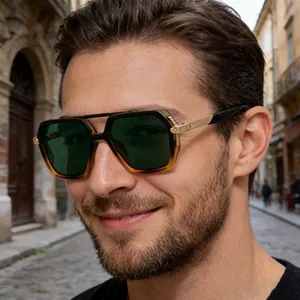Close-up of square tortoise frame sunglasses with gold textured temples on model