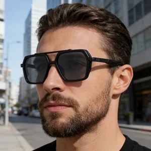 Close-up of black double-bridge square sunglasses with metallic details on temple
