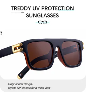 Primer plano de gafas negras mate con detalles dorados y lentes teñidas marrones