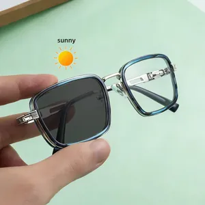 Detail of square photochromic sunglasses showing lens color change under sunlight