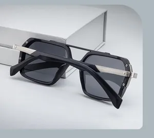 Detail of square sunglasses with double bridge and textured silver metal temple arms