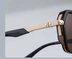 Detail of gold metal temples with vertical stripes and star rivets on square sunglasses