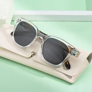 Modern oversized square sunglasses with transparent frames and chic cream leather case