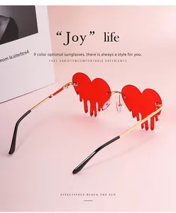 Detailed view of red heart melting sunglasses with decorative crystals and gold metal temples