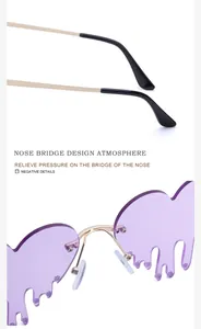 Detail of nose bridge and temple tips of purple melting heart sunglasses with gold frame