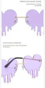 Close-up of heart-shaped sunglasses with purple lenses and dripping diamond accents