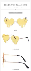 Three angles of yellow melting heart sunglasses with rhinestones and gold metal frames