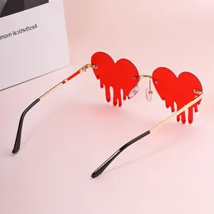 Chic melting heart red sunglasses with gold metal frame and teardrop design