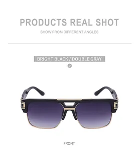 Vue de face de lunettes de soleil noires avec pont en métal doré et verres dégradés