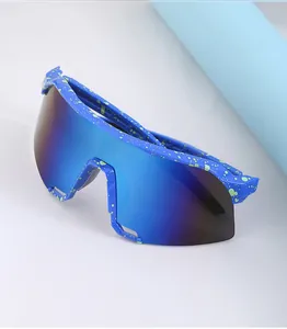 Detail of blue polarized lens and green splatter texture on sports cycling sunglasses