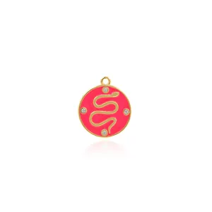 Detailed view of red enamel snake pendant with gold plating and four zircon stones