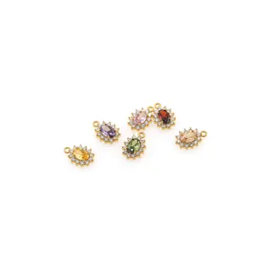 Close-up of 18K gold plated oval pendants with colorful zircon stones for DIY jewelry making