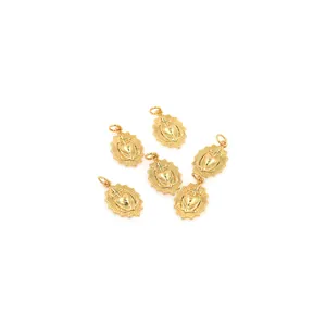 Detailed view of six 18K gold-plated sacred heart cross pendants for jewelry making