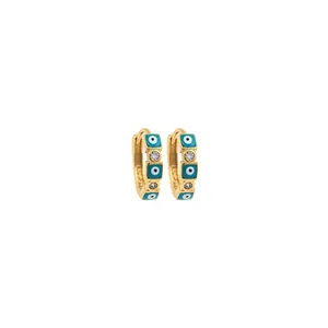 Detailed view of 18K gold-plated hoop earrings with blue evil eye enamel and cubic zirconia