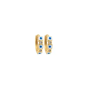 Macro shot of 18K gold plated huggie hoops with evil eye enamel and zirconia stones