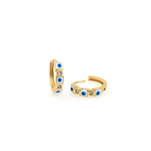 Detail of 18K gold-plated evil eye hoop earrings with blue enamel and pavé zircon stones