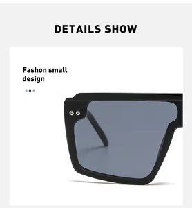 Vue détaillée des lunettes de soleil carrées noires avec rivets argentés élégants