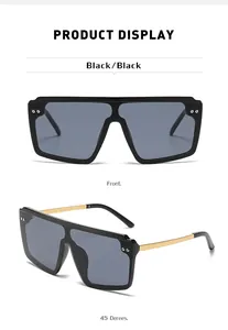 Vues de face et à 45 degrés de lunettes de soleil oversize avec branches dorées